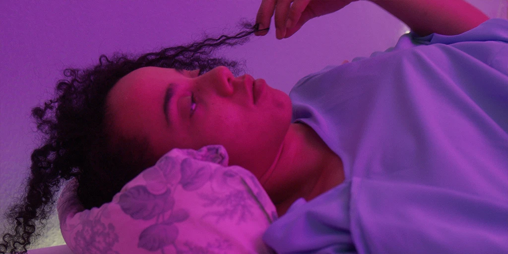 Lena (Shari Asha Crosson) lies thoughtfully in the newly furnished nursery in the feature film »The Mathematics of Things«